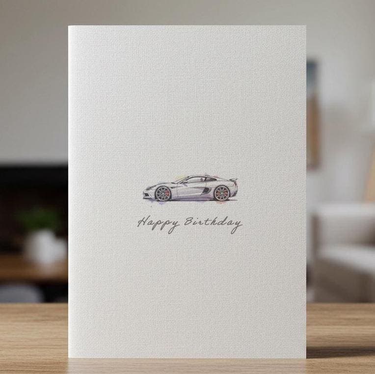 Linen birthday card with a watercolour sports car, standing on a wooden surface