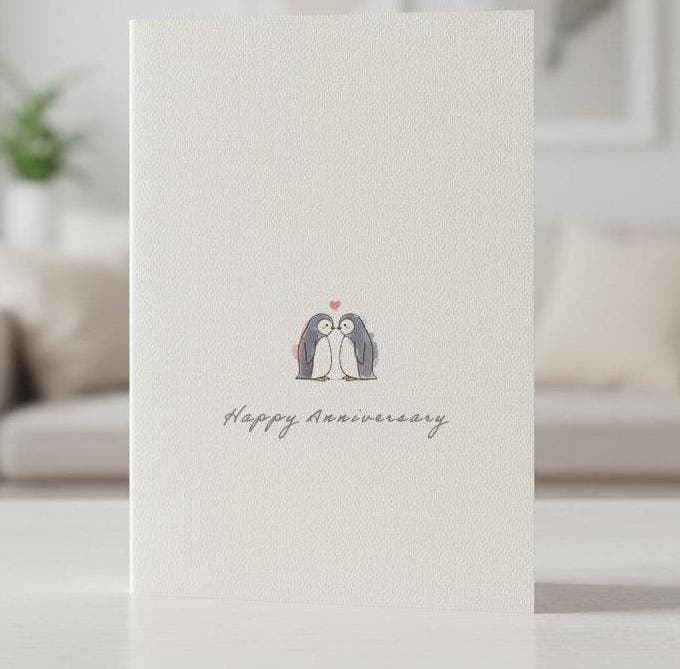 Linen anniversary card with two watercolour penguins standing close together